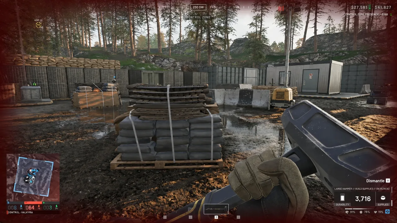 Crosshair on a sandbag barricade in a Control Zone with the Dismantle action available