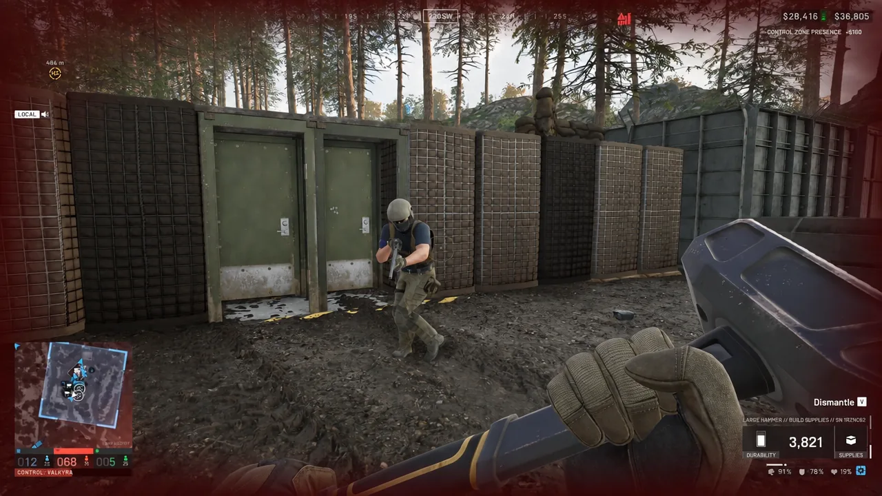 First-person view in WARDOGS with the Large Hammer held ready inside a friendly position