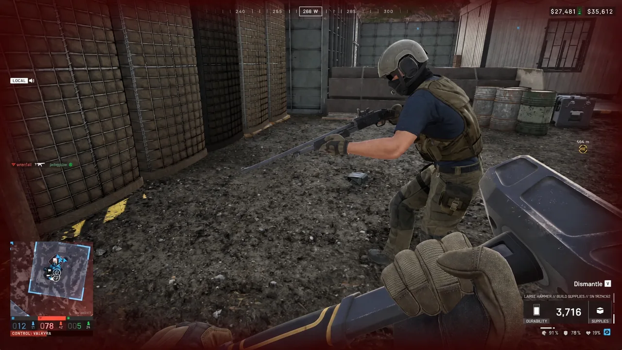Large Hammer held near a friendly armored soldier with the Dismantle prompt visible on screen