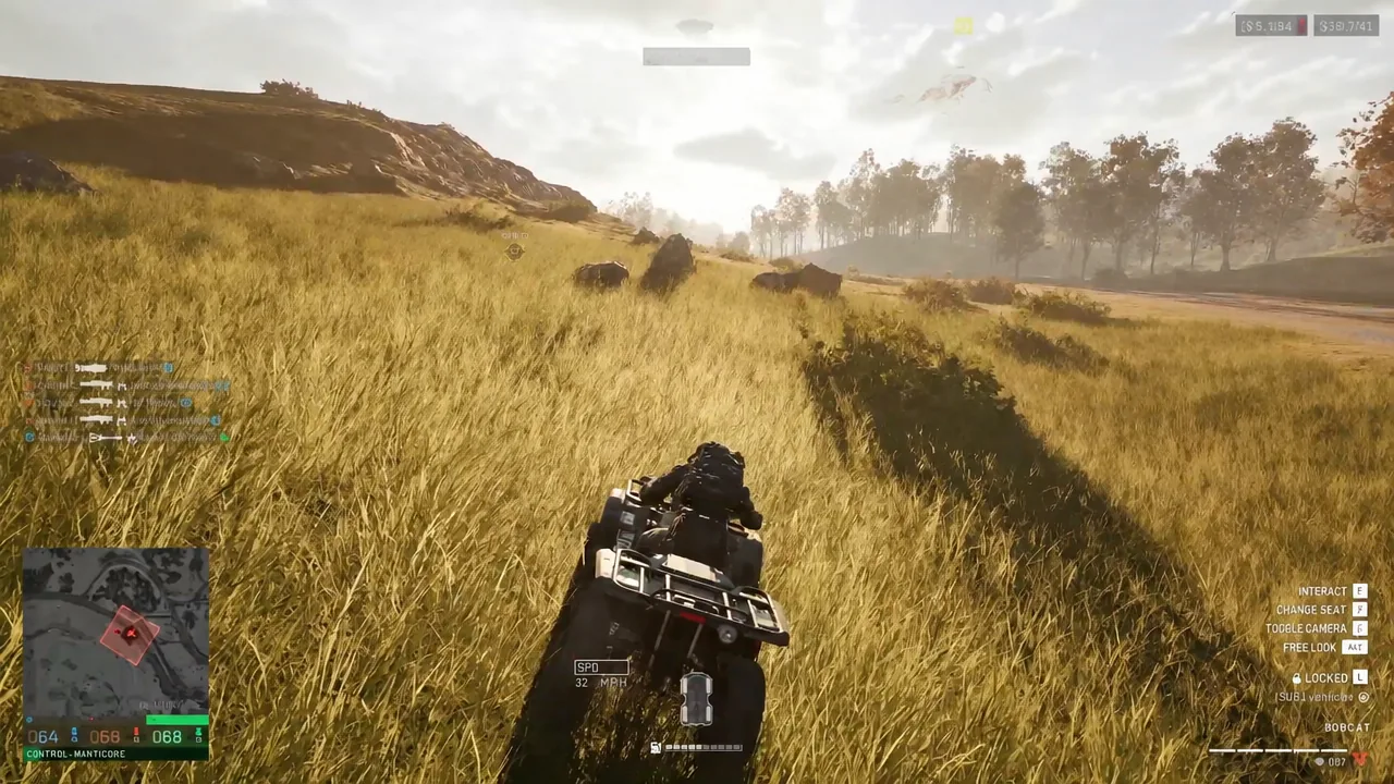Driving an ATV through tall grass with the interact prompt on screen