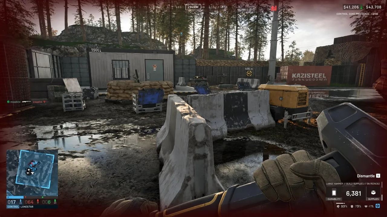 Large Hammer equipped in front of concrete barriers with the Dismantle prompt on screen