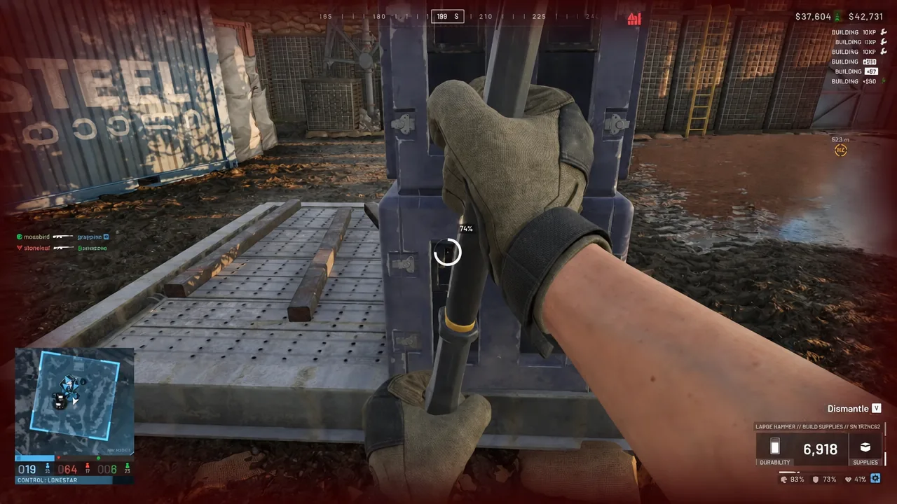 Player swinging the large hammer at a structure with a 74 percent progress indicator on screen