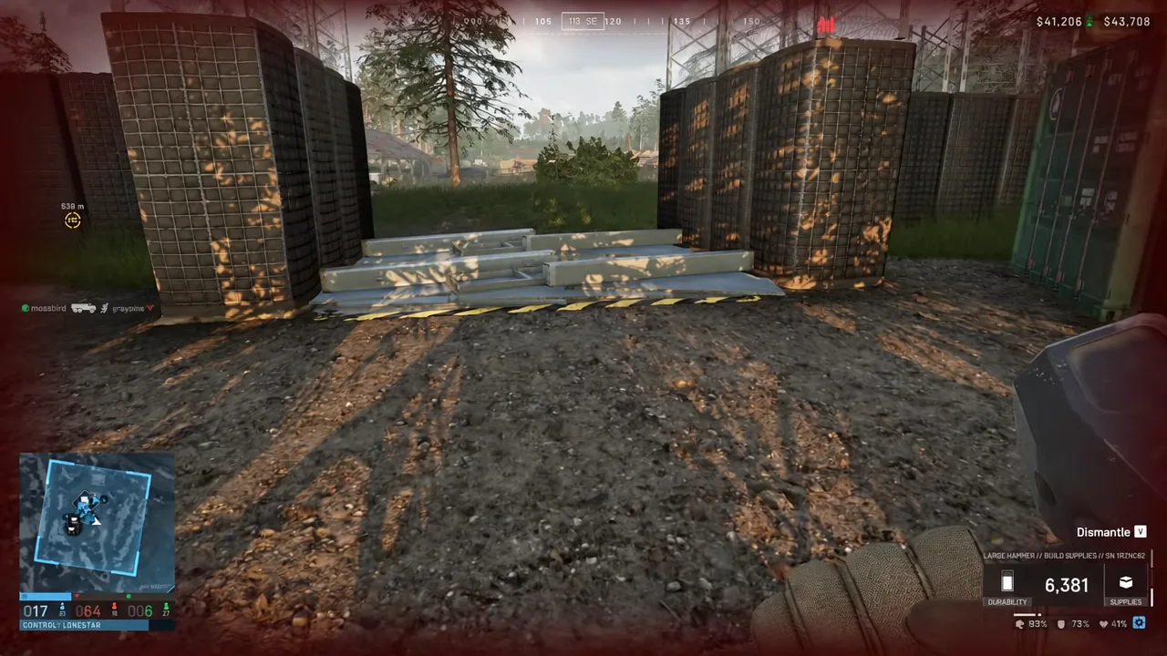 A metal barricade highlighted in-game with the dismantle prompt active