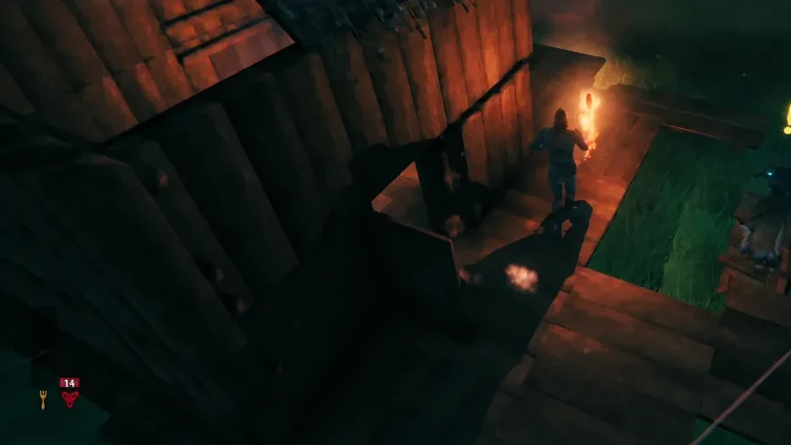 Viking carrying a lit torch while walking along a wooden walkway at night