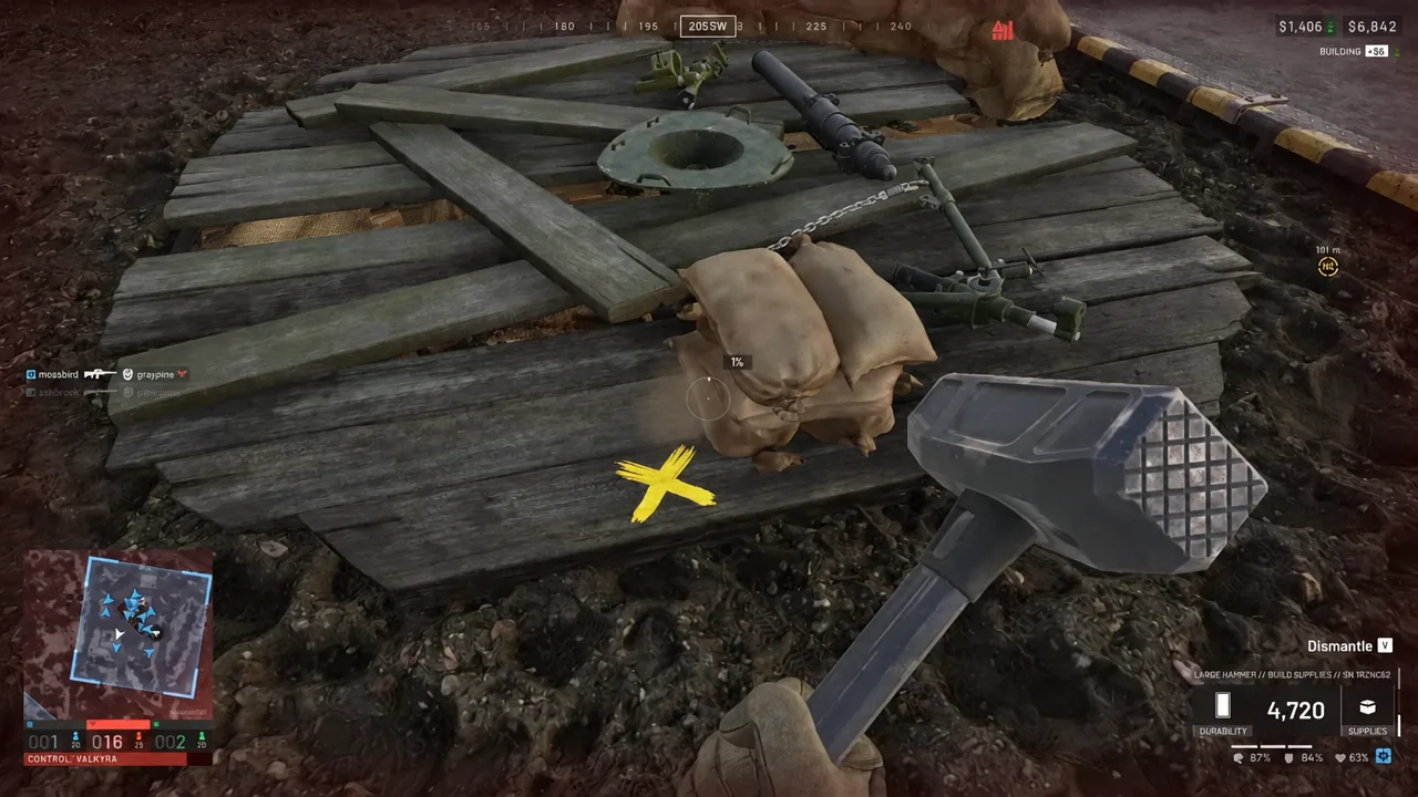 Player striking a highlighted wooden structure with the hammer in Dismantle mode.