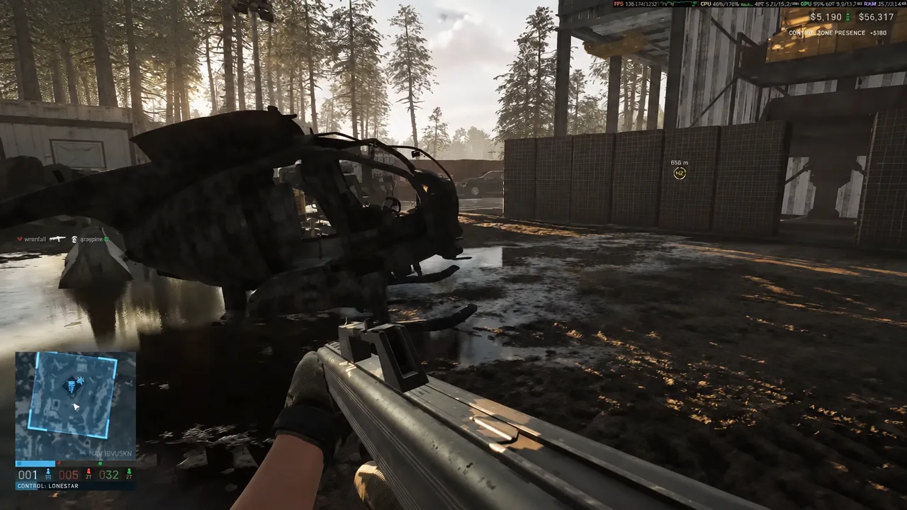 First-person rifle view past a crashed helicopter toward a marked tower objective