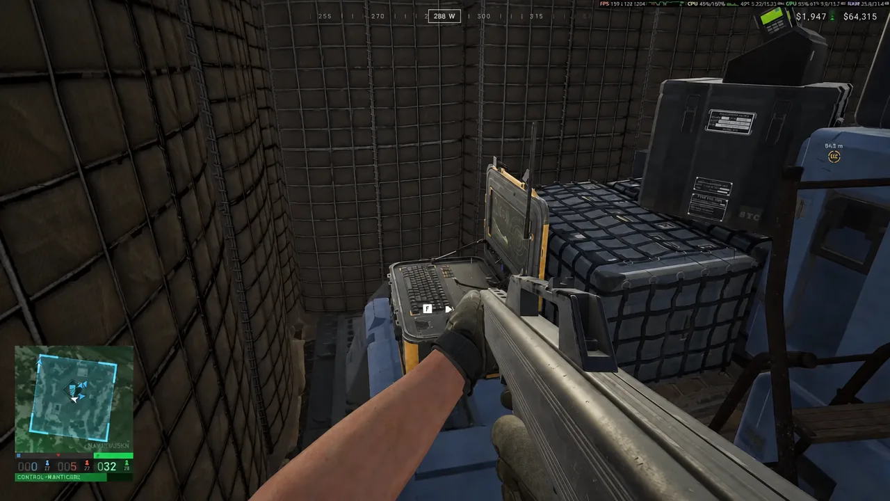 Hold F interaction prompt displayed over an open laptop console inside a Wardogs tower