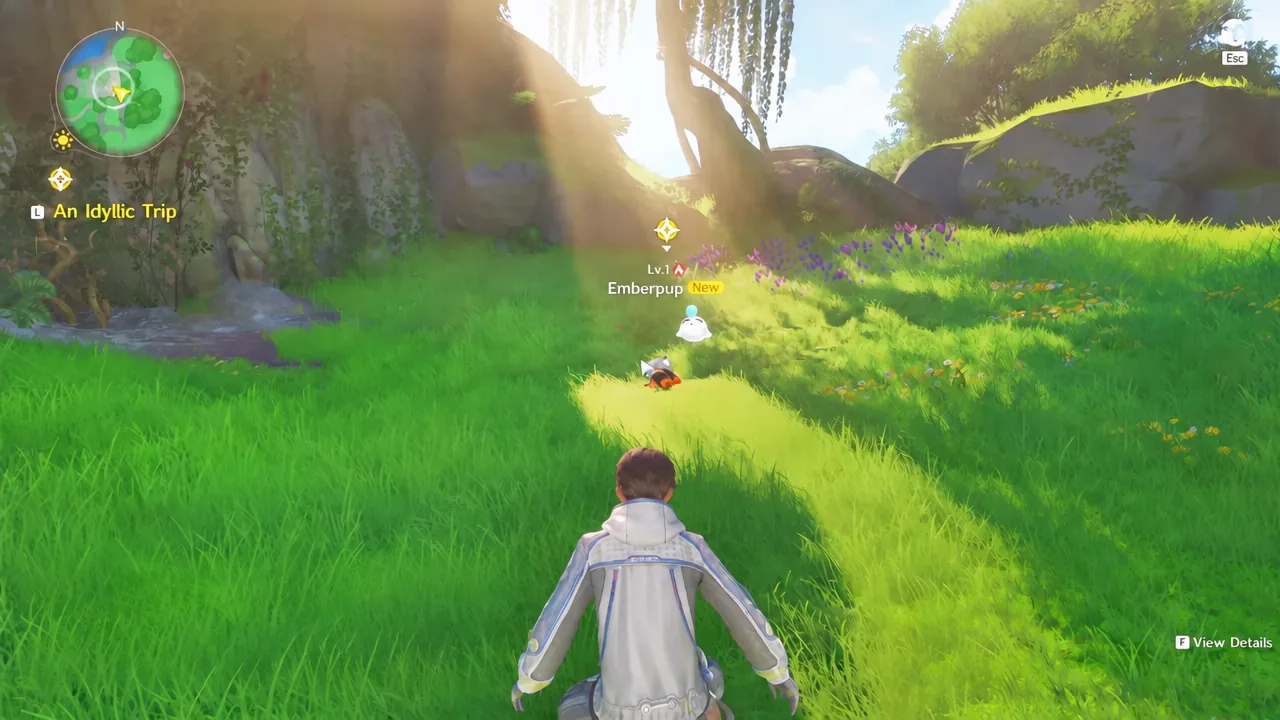 A wild Emberpup in tall grass with the on-screen F prompt showing as the player walks up to it