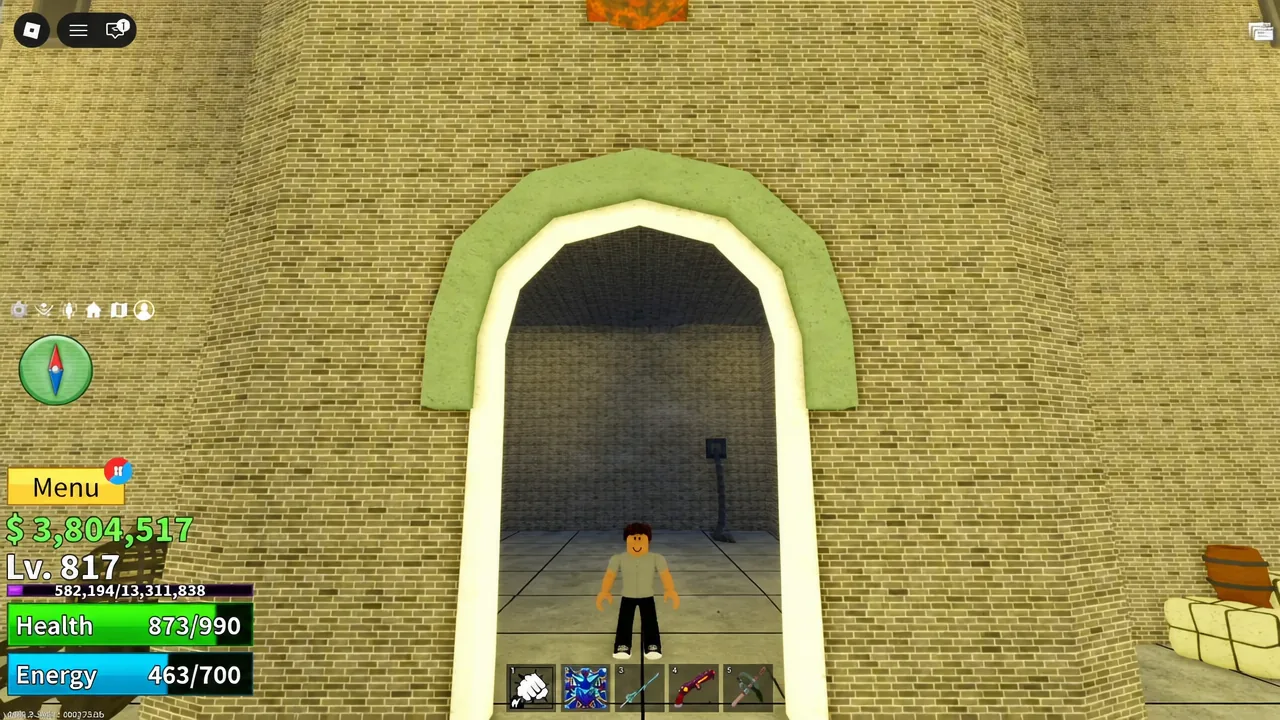 Player standing in an arched doorway at the top of the prison keep