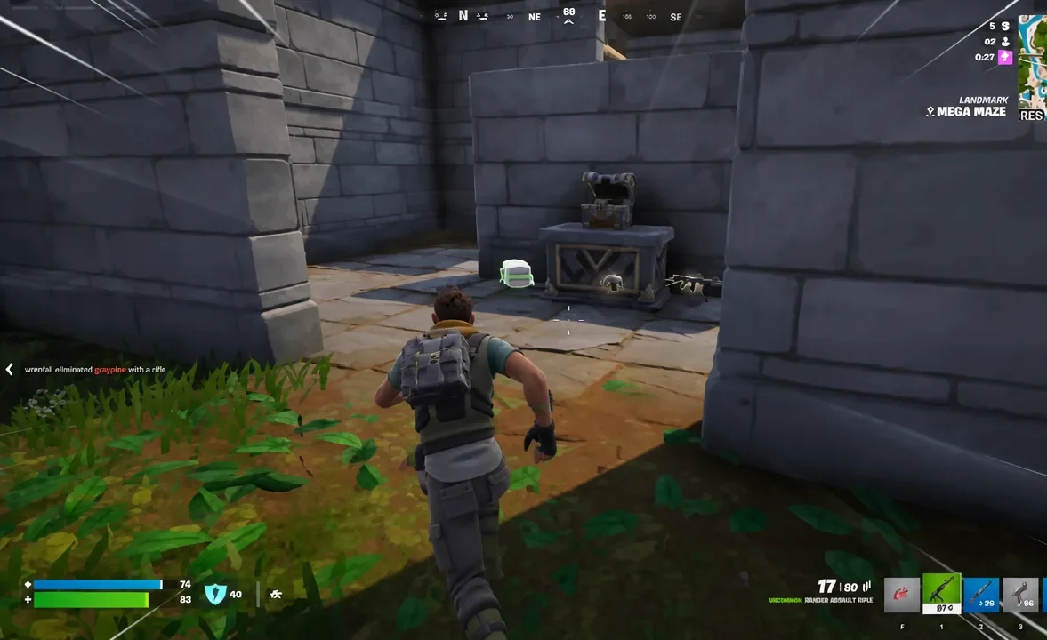 Close-range fight inside the Mega Maze corridors with chests and a console nearby