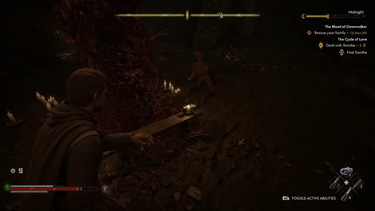Coen searching a candlelit altar inside Xanthe's manor with the Rescue your family objective tracked
