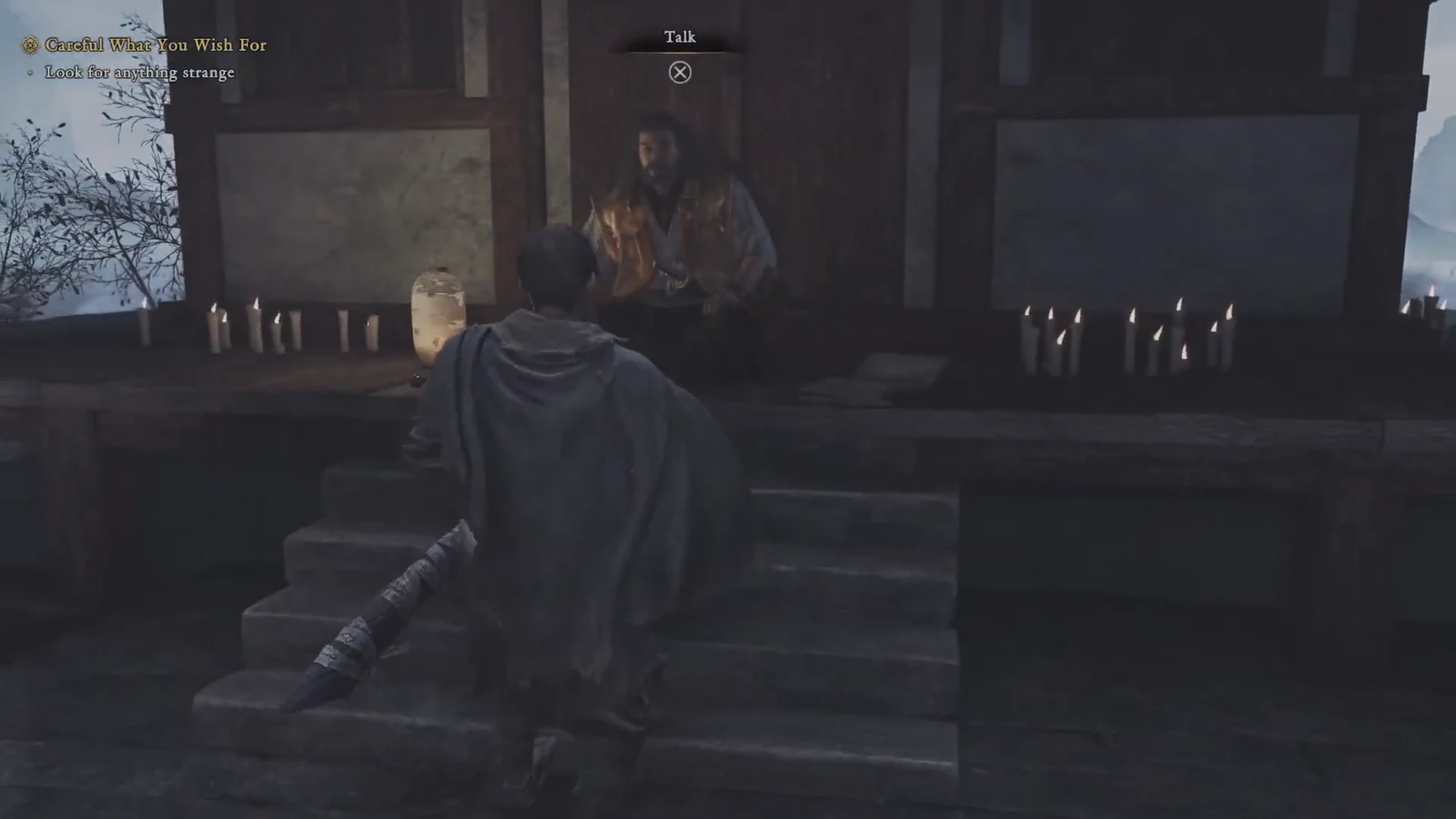 The Talk interaction prompt appearing as Musashi approaches the seated instructor Takamura