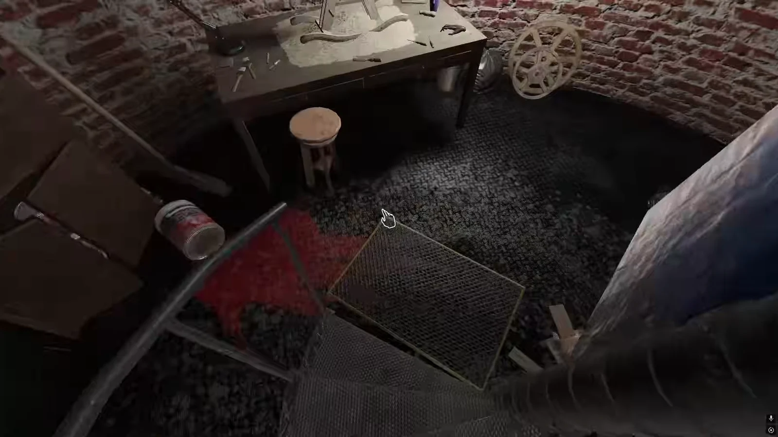 Interaction cursor over a wire-mesh gear panel on the Maintenance Room floor near a paint bucket