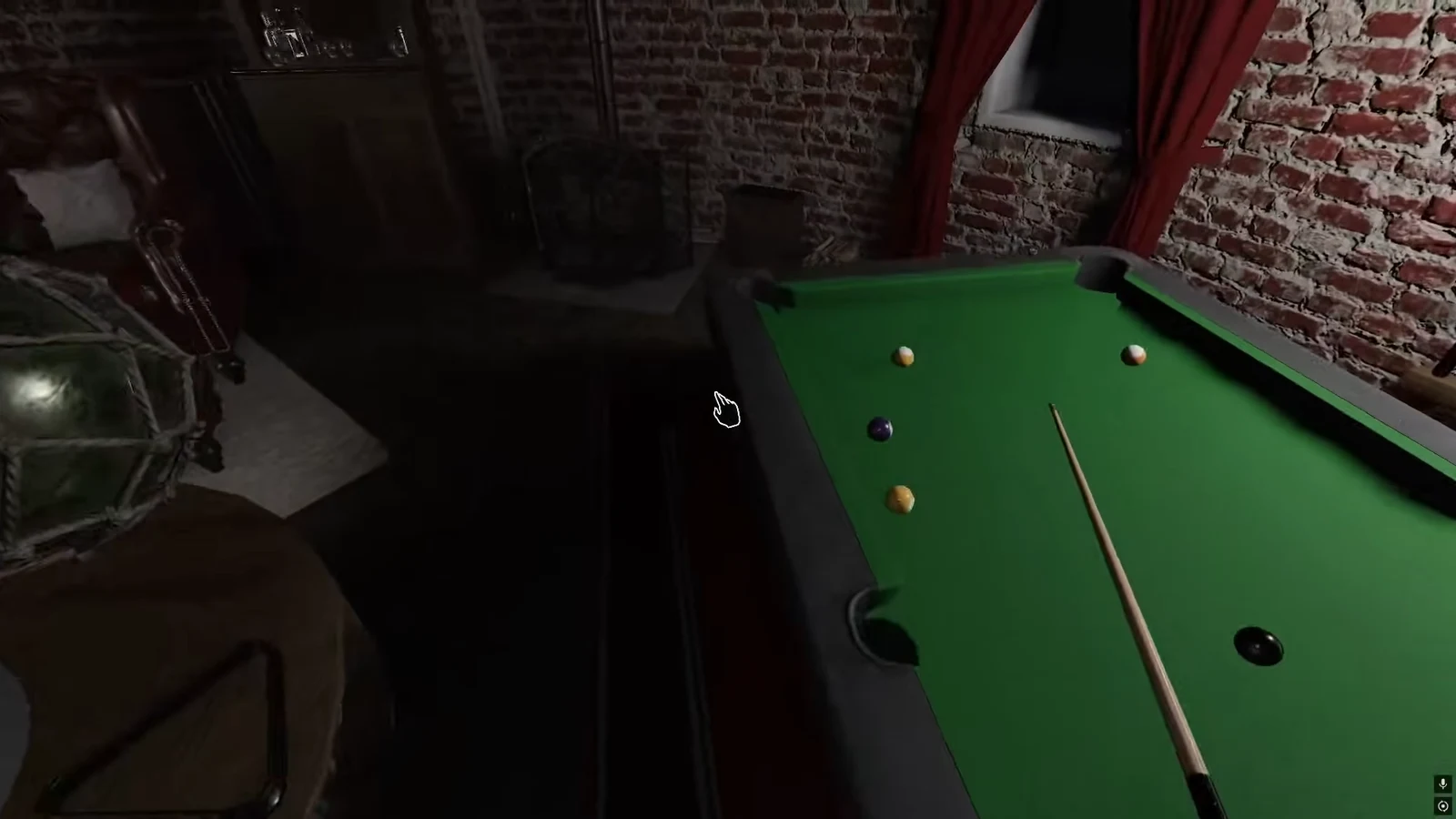 Pool table with cue lined up among the billiard balls in the Point Hope Games Room