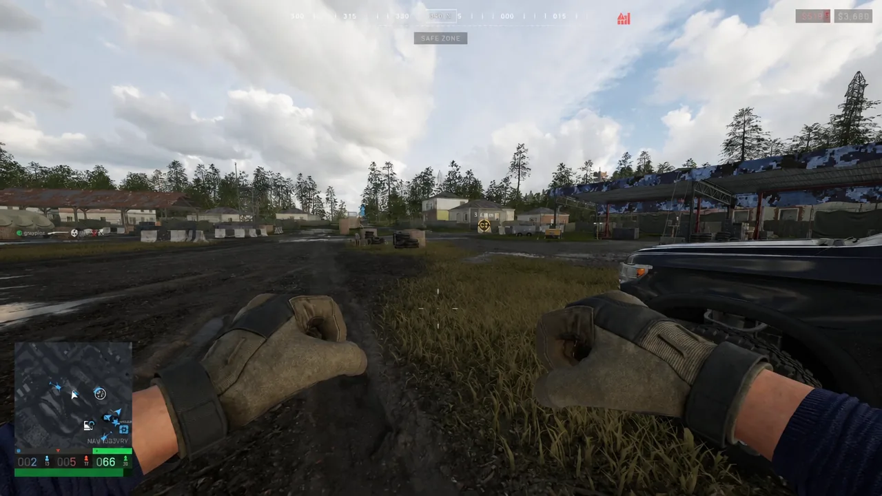 Unarmed player moving through the Safe Zone with the objective marker visible on the HUD