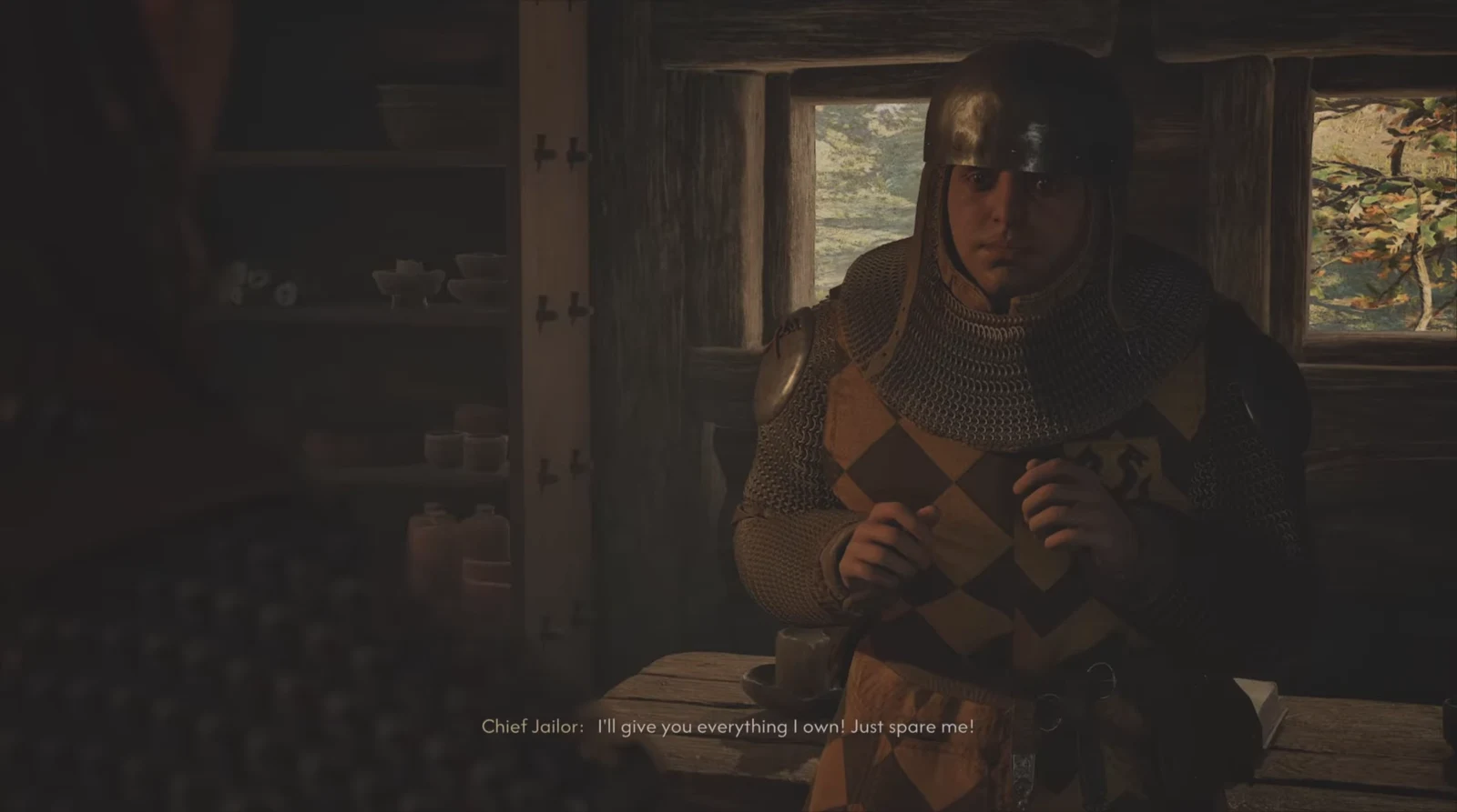 Cutscene of the Chief Jailer pleading for his life inside a wooden cabin