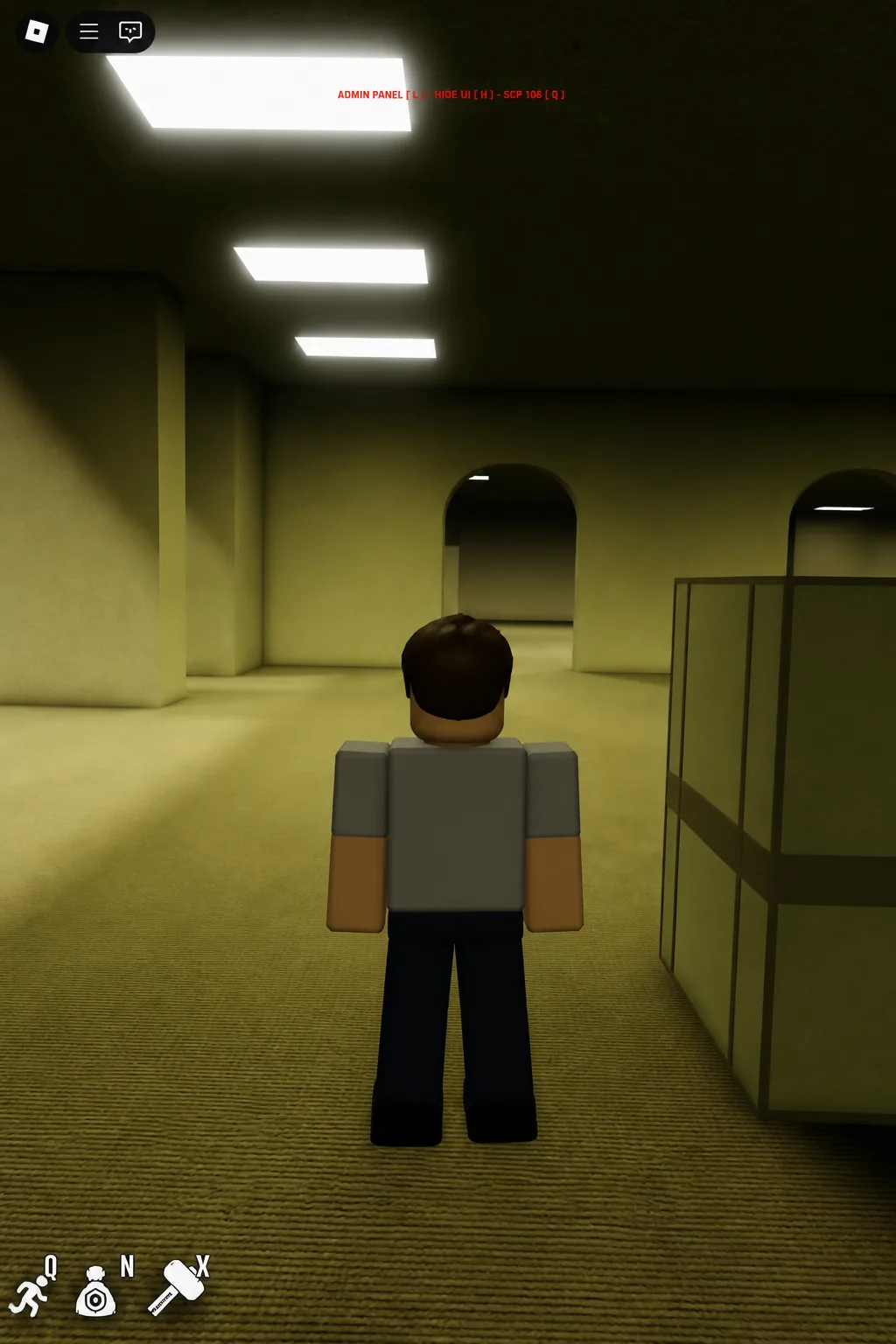 Player standing in a dim corridor with an on-screen interaction prompt overlaid