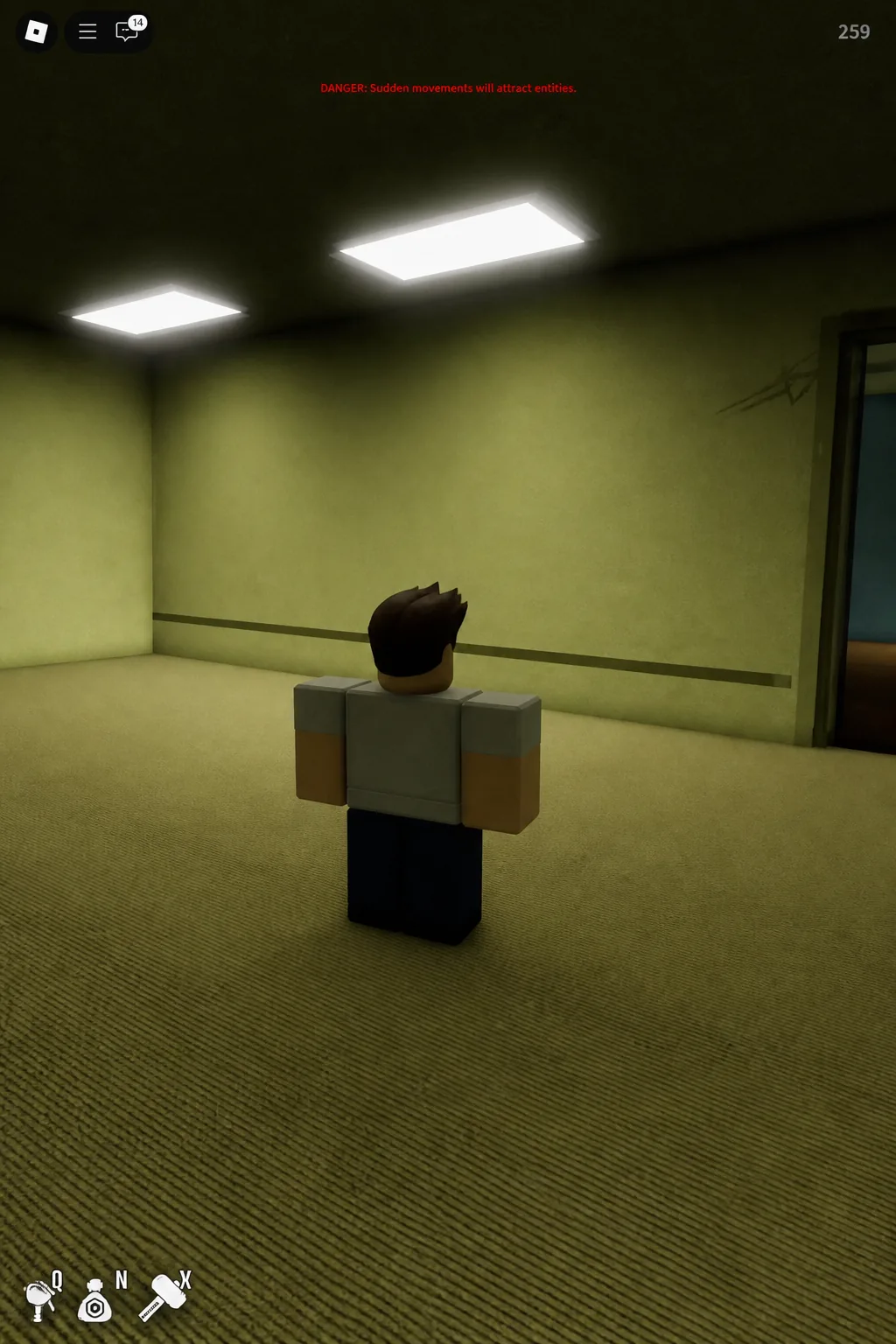 Player holding still in a hallway as an on-screen warning about attracting entities appears