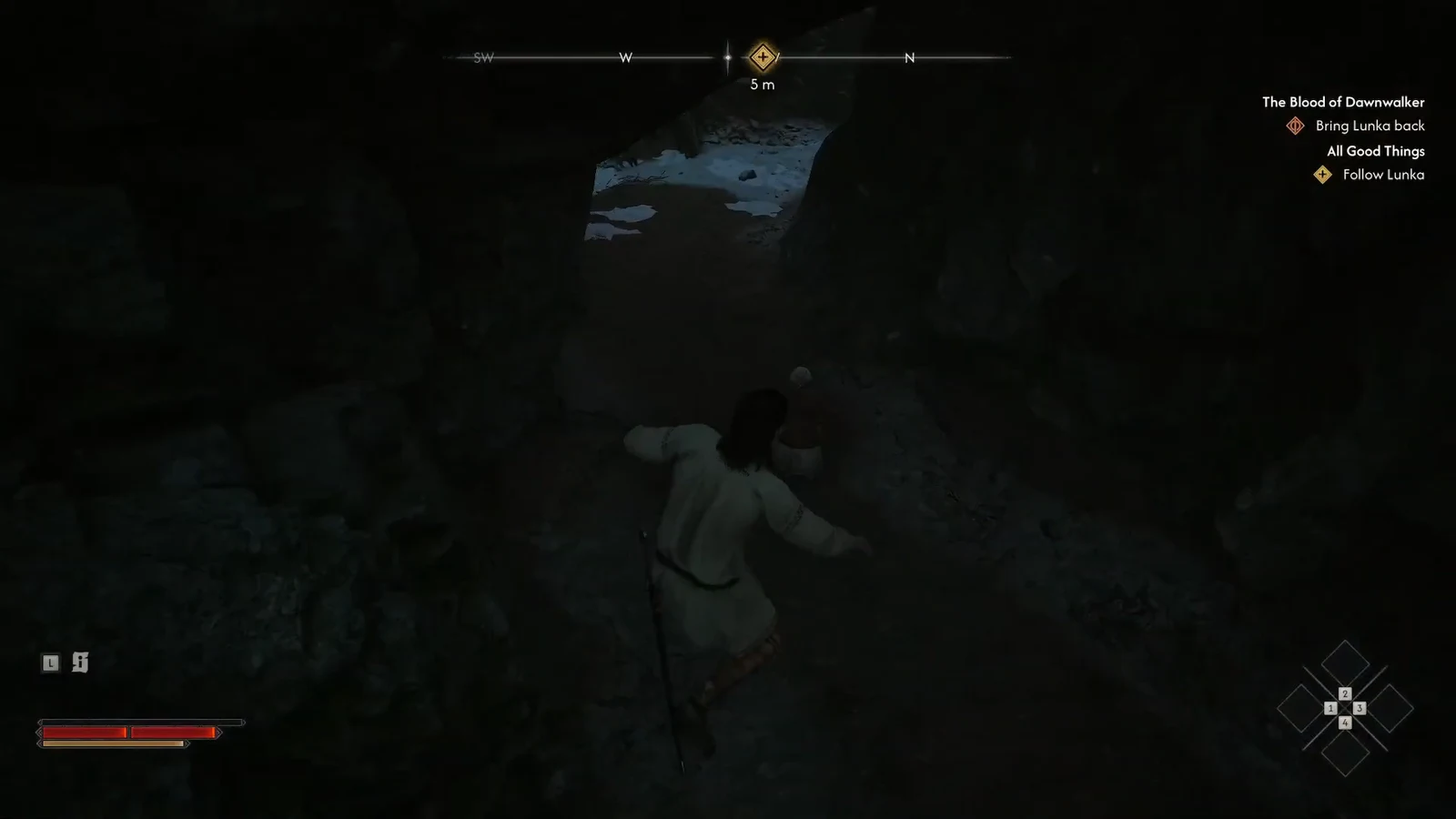 Coen moving through the dark cave tunnel with the objective marker five meters ahead