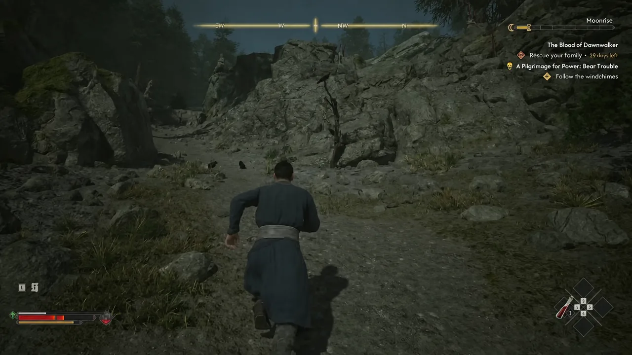 Coen running up a rocky mountain path at night with the quest tracker still active
