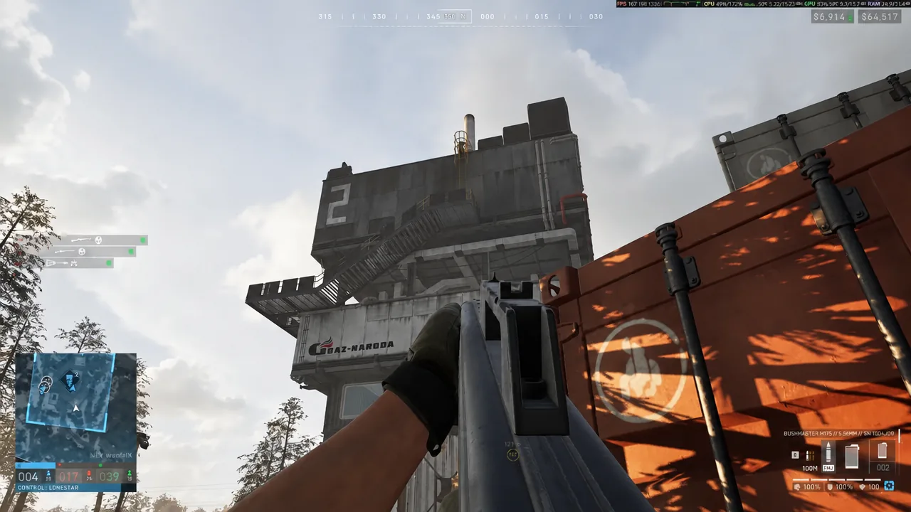 Player aiming a rifle up at a numbered tower building beside an orange shipping container