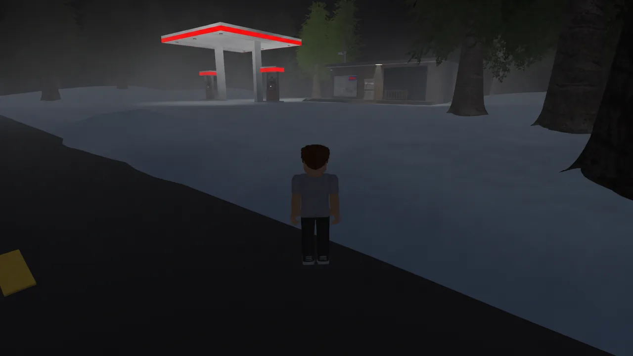 Player character walking toward a lit gas station at night in the Dream World