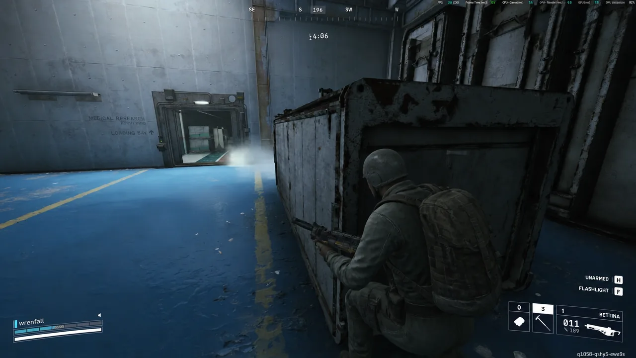 Player crouches behind a crate aiming a rifle toward the loading bay before engaging a Shredder