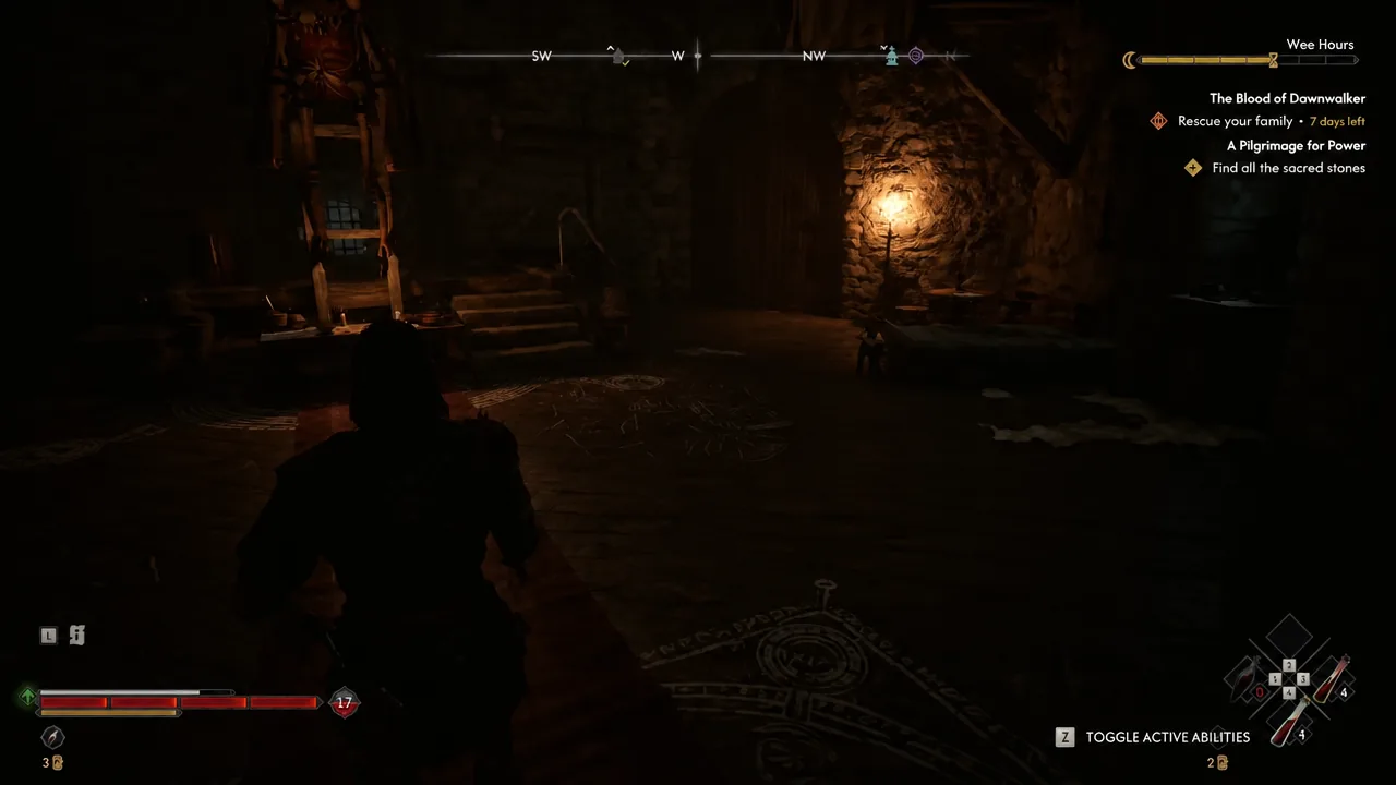 The dim ritual room at the top of the tower where the flask sits on a low table
