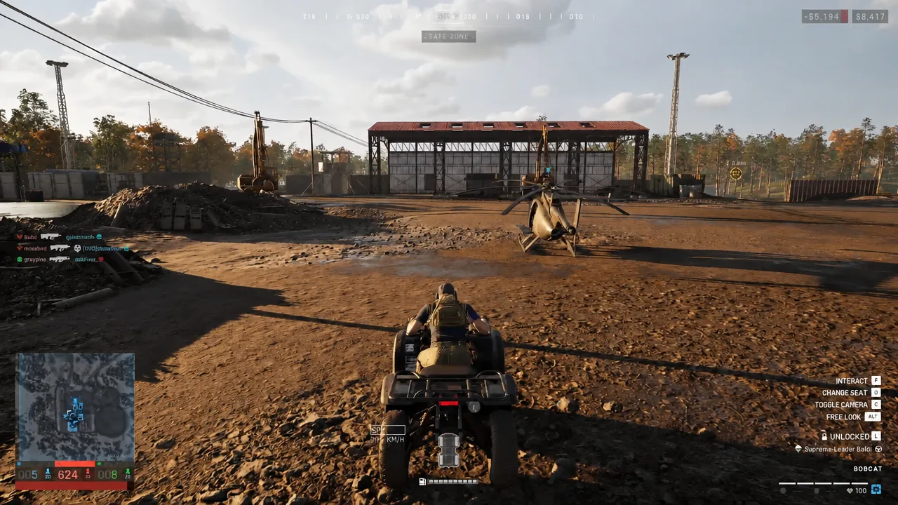 Driving a quad bike toward a helicopter with the Interact [F] prompt on the right of the screen