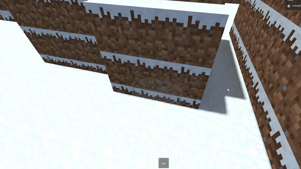 Snow-covered dirt wall on the Snowy map beside the wooden watchtower