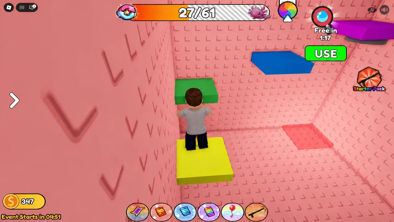 Green USE button on screen while the avatar stands on a yellow platform during the block jumping route