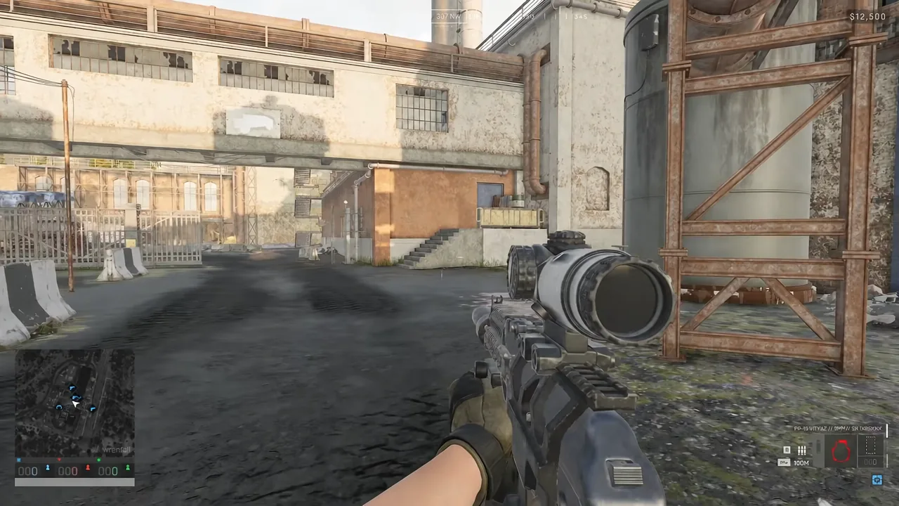 Moving through an industrial yard while carrying a fully kitted scoped rifle