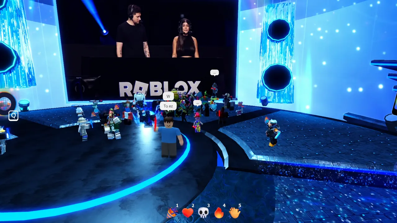 Player avatar walking toward the crowded main stage inside the RIA26 venue in The Block