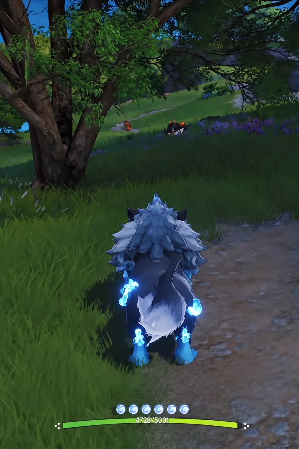 Player character moving along a forest path with health bar and ability icons on screen
