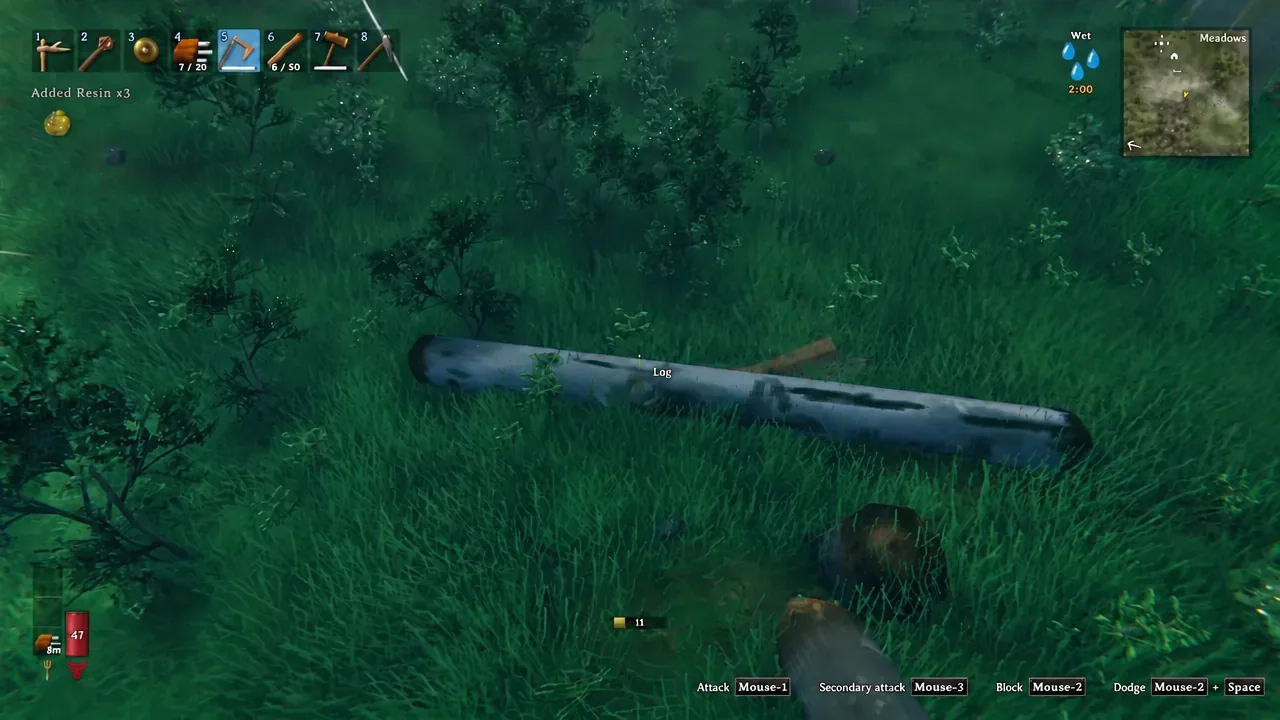 Finewood and wood pickups scattered on the grass after a birch log is fully broken
