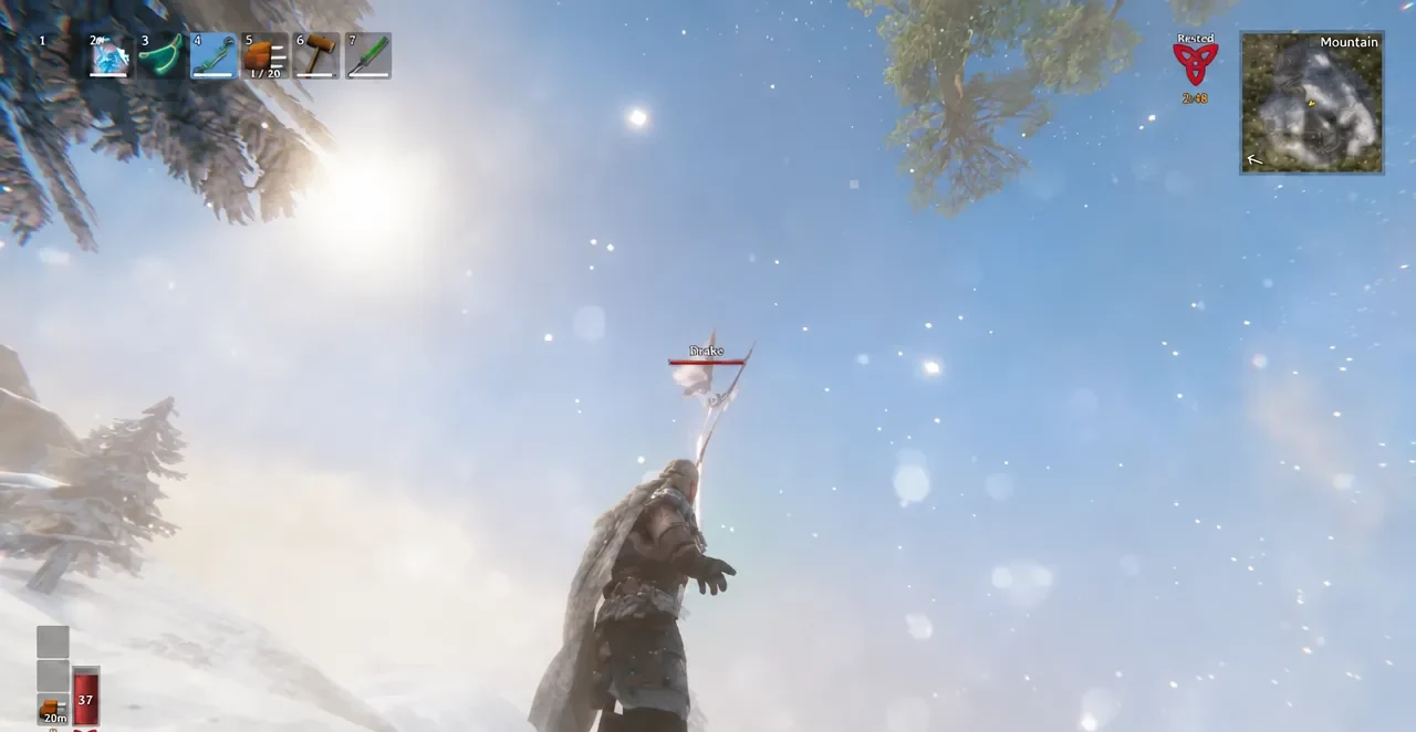 Player aiming a drawn bow at a Drake flying over the mountain