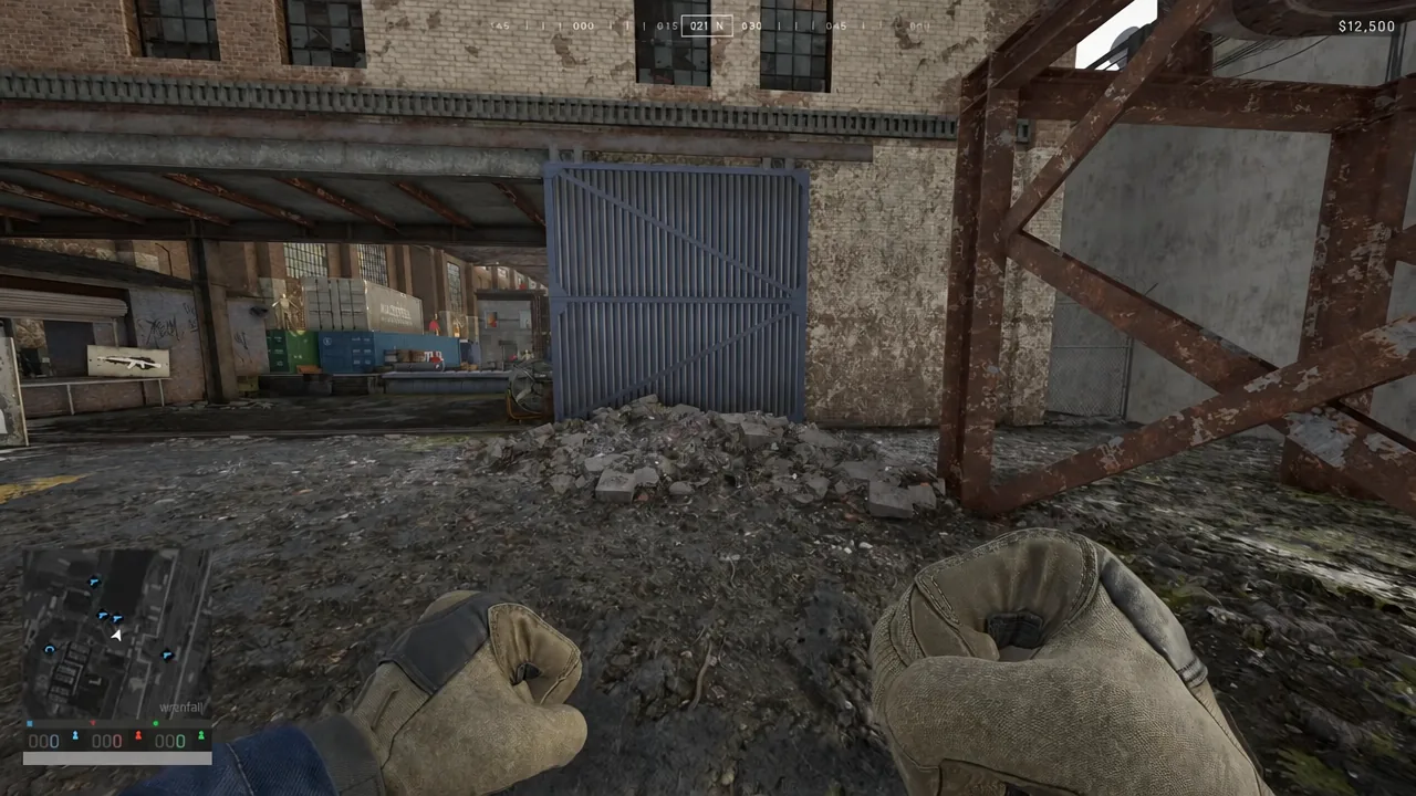 First-person view with bare fists raised while walking up to a blue metal gate in Wardogs