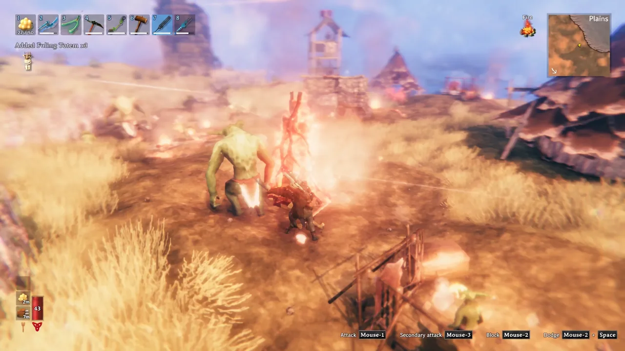 Combat next to a campfire in a Fuling camp as the Fuling Totem pickup message appears on screen