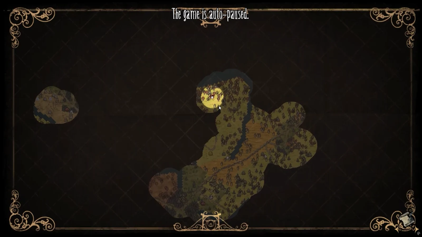 Auto-paused world map showing explored terrain and the player marker inside a forested area