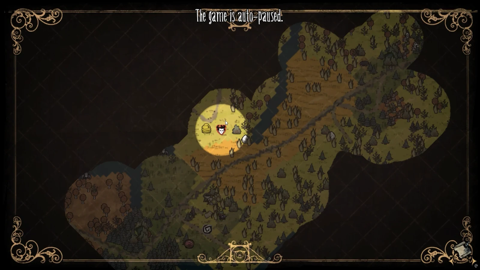 The auto-paused world map showing explored forest terrain and the player's position near a bee hive.