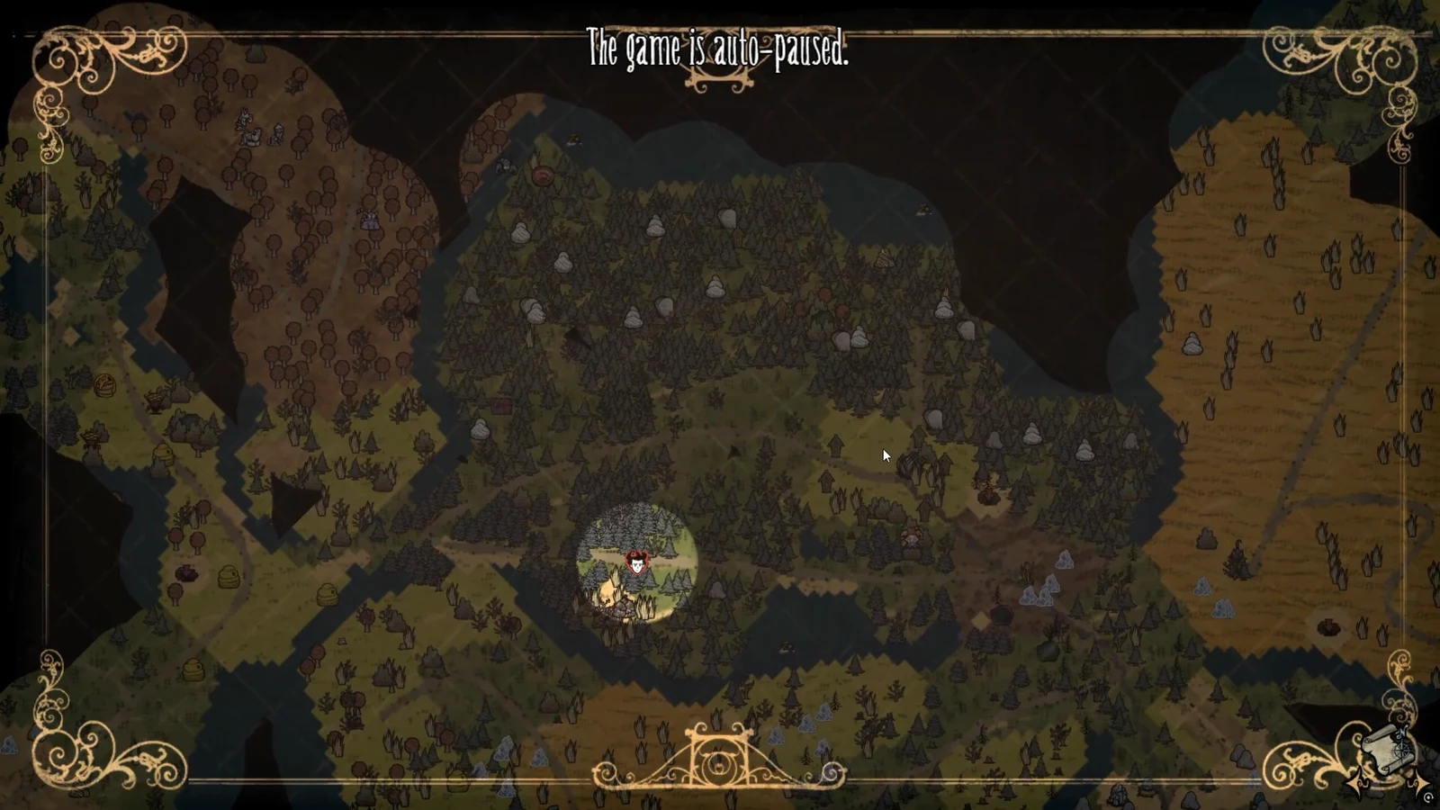 Paused map view of a forest clearing where grave clusters can be dug with a shovel