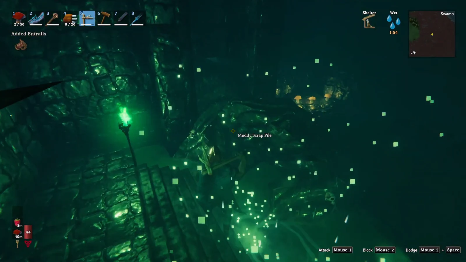 Player mining a highlighted Muddy Scrap Pile with a pickaxe equipped from hotbar slot five