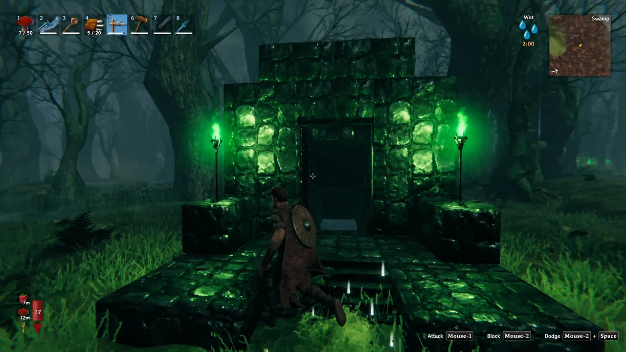 Player walking toward a Sunken Crypt entrance lit by green torches in the Swamp at night