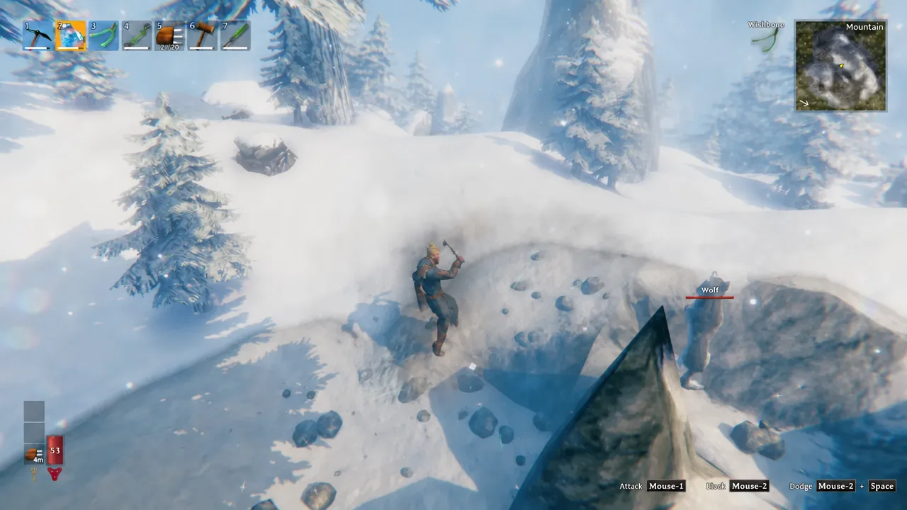 Player swinging at a wolf in the snow with the Attack Mouse-1 prompt on screen