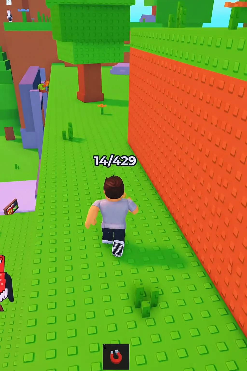 Avatar running along a green platform with a magnet in the first hotbar slot and a 14/429 counter