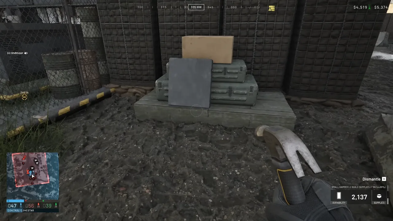 Player aiming at a stack of supply crates with the dismantle prompt shown on screen