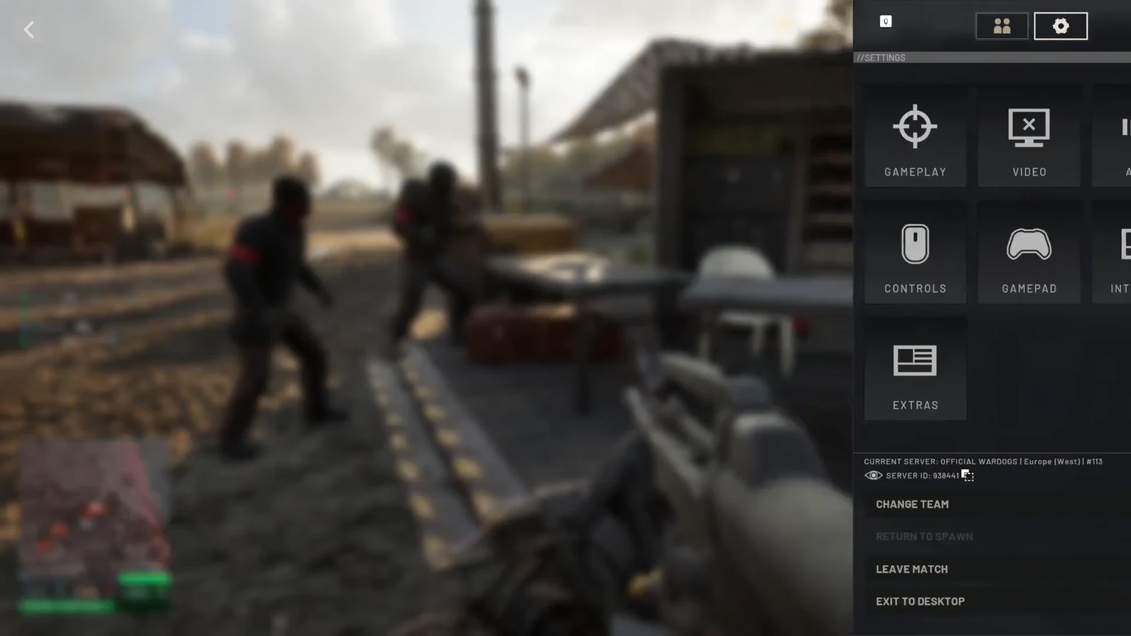 Wardogs menu open on the gear tab with Gameplay, Video, Controls, Gamepad, and Extras listed