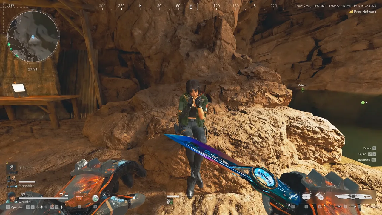 Operator holding a rifle on a rocky ledge while moving toward the boss building in Layali Grove