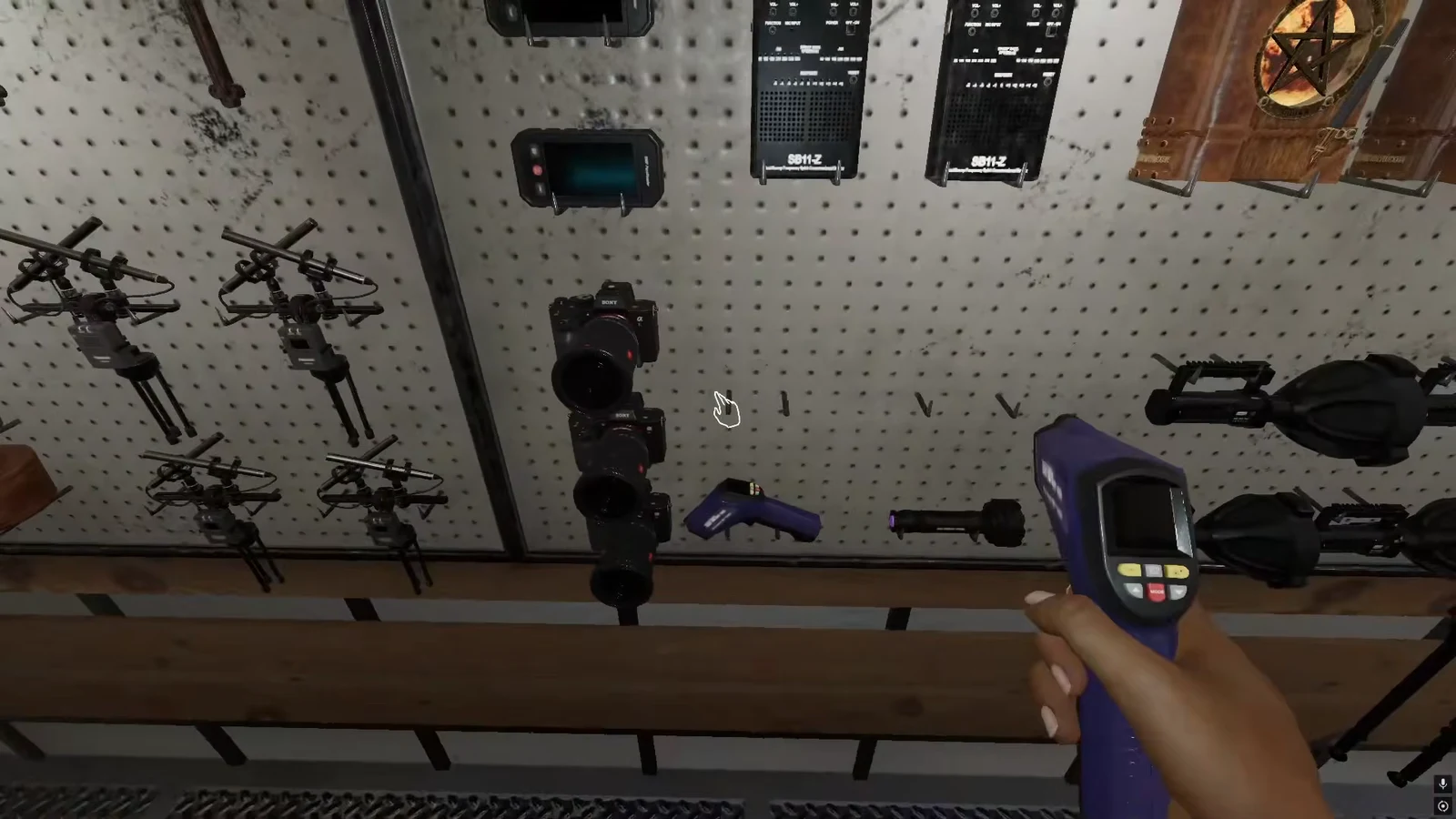 Player holding a thermometer while picking equipment off the truck rack in Phasmophobia
