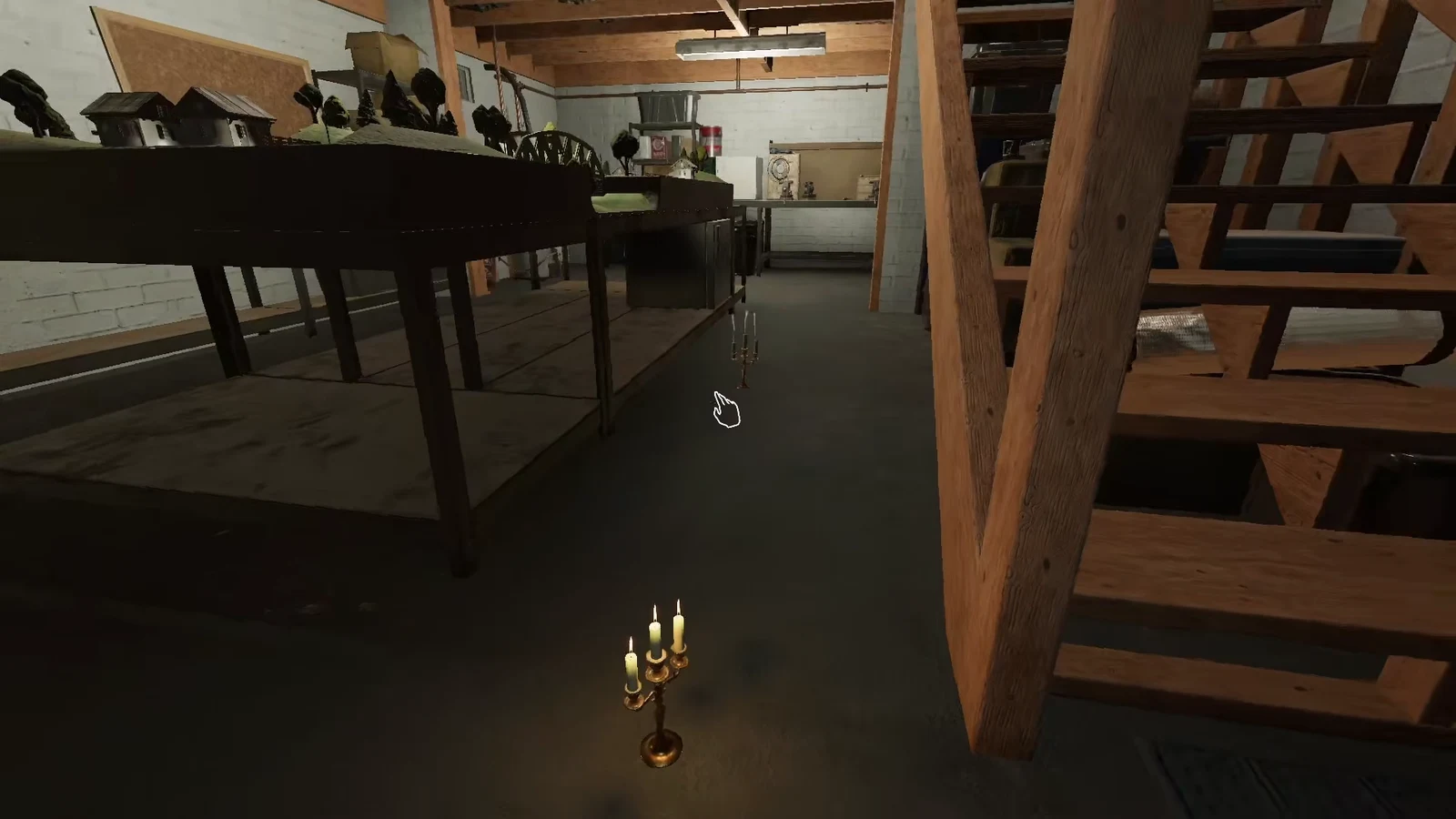 Player aiming at a small candelabrum resting on the workshop floor